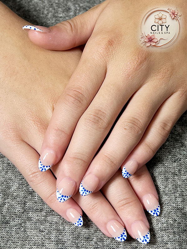 Custom nail art design with chrome and rhinestones